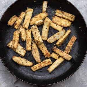Tofu strips browning in a skillet