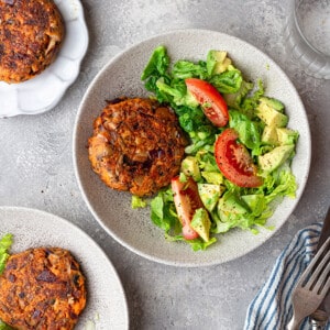 Top view of three veggie burger salads with a fork