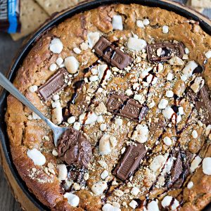 Flourless Nutella Stuffed S'mores Skillet Cookie makes the perfect easy decadent sweet treat for sharing at a party!