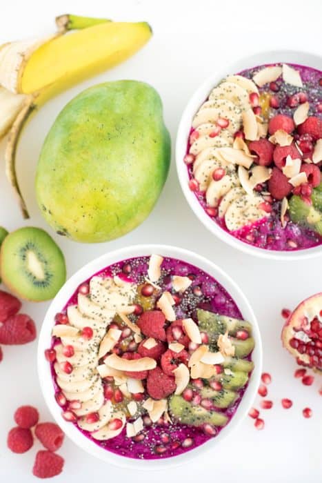 Overhead view of Fruit Smoothie Bowls topped with fruit and nuts