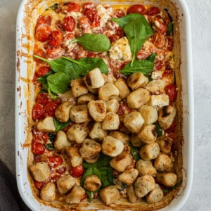 Top view of vegan baked feta pasta in a white casserole dish