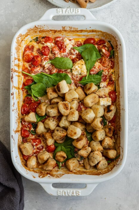Top view of vegan baked feta pasta in a white casserole dish