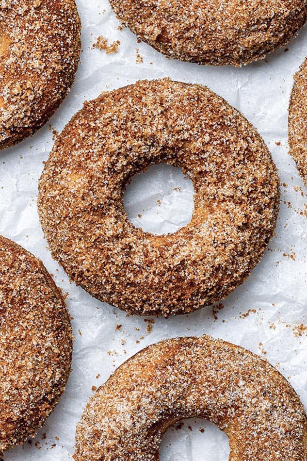 Close-up shot of 1 baked cinnamon sugar donuts on a white background
