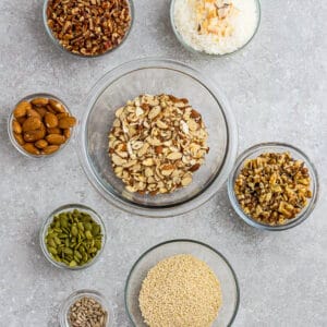 Top view of ingredients to make grain free gluten free granola on a grey background
