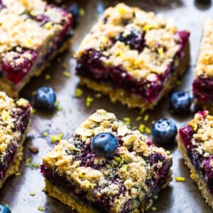 Top view of paleo blueberry crumb bars on a baking pan