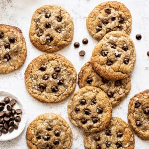 Top view of 10 paleo chocolate chip cookies on a white background
