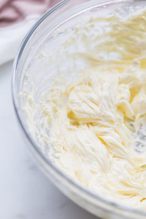 Cream cheese frosting in a glass bowl