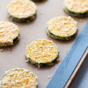 A baking sheet with unbaked zucchini chips