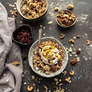 Coconut Cardamom Granola is the perfect easy grab and go breakfast or snack. Best of all, it's gluten free & full of crunchy clusters, nuts & warm spices.