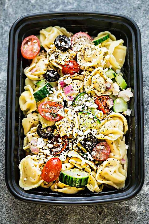 Top view of Greek Tortellini Pasta Salad in a meal prep container