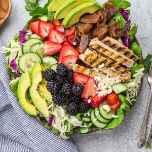 ﻿Summer Berry Grilled Chicken Salad - an easy and healthy lunch or dinner perfect for busy weeknights or summer potlucks. Made with avocado, cucumber, bacon, strawberries, blackberries and tomatoes with a tangy, fresh and flavorful lemon vinaigrette.