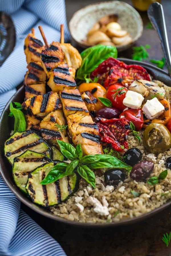 Top view of a Grilled Greek Chicken Souvlaki Quinoa Brown Rice Bowl