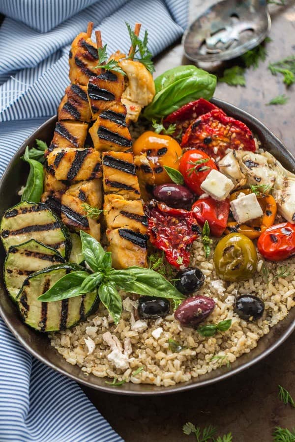 Top view of a Grilled Greek Chicken Souvlaki Quinoa Brown Rice Bowl