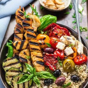 Top view of a Grilled Greek Chicken Souvlaki Quinoa Brown Rice Bowl