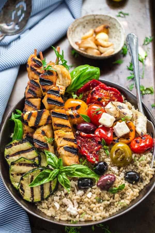 Top view of a Grilled Greek Chicken Souvlaki Quinoa Brown Rice Bowl