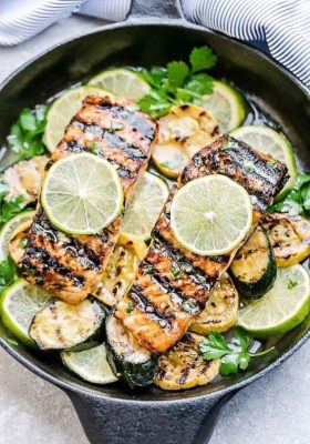 This Honey Lime Salmon is a light and tasty dish that is just perfect for summer and busy weeknights. Best of all, it can be made on the grill or in your oven. It's marinated with a delicious sweet and tangy honey and lime butter sauce and the salmon gets cooked to tender flaky perfection every time! Clean up is a breeze if you want to roast it in foil packs or cook it directly on the grill for those pretty grill marks!