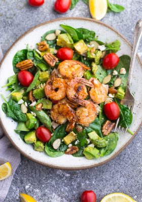Grilled Shrimp Avocado Salad - a light and healthy & flavorful dish perfect for lunch or a light dinner. Made with spinach, avocado, cherry tomatoes, pecans, almonds and a homemade poppy-seed dressing. Low Carb, keto, paleo & Whole 30 compliant.