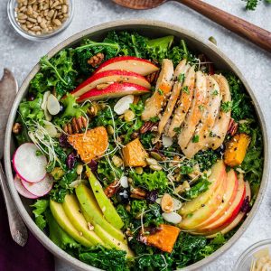 Harvest Fall Salad is full of hearty autumn vegetables, in season fruit with a simple apple cider vinaigrette. Made with kale, endive, chicken, crispy apples, pears, roasted pumpkin, cranberries and crunchy pecans. Best of all, with low carb, keto, paleo & whole 30 options.