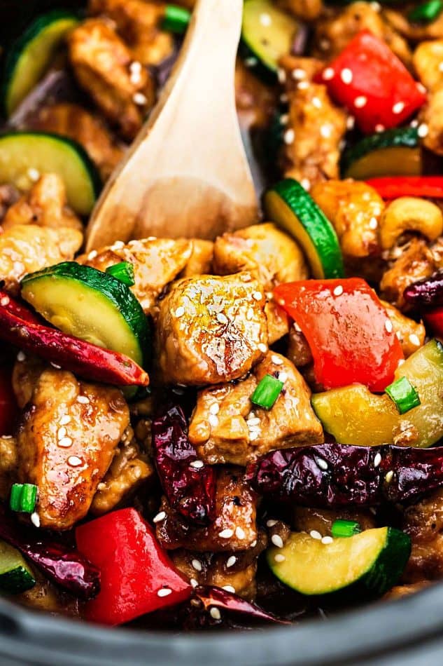 Healthier Slow Cooker Kung Pao Chicken makes the perfect easy and lightened up weeknight meal. Best of all, this takeout favorite, is SO much healthier and better than your local restaurant with just a few minutes of prep time. With gluten free and paleo friendly options.