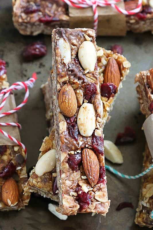 Close-up of a homemade granola bar with almond and cranberries