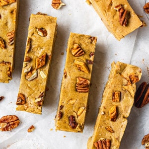 Overhead view of apple pie protein bars topped with pecans
