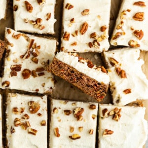 Top view of carrot cake bars on parchment paper