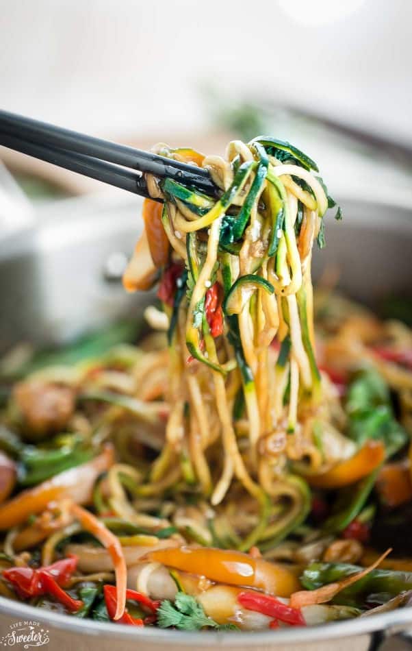 chopsticks holding some healthy chicken chow mein zoodles (zucchini noodles)