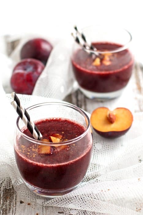 Two glasses of Healthy Cinnamon Plum Smoothie with straws