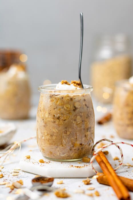 Side view of Gingerbread Overnight Oats in a jar with a spoon