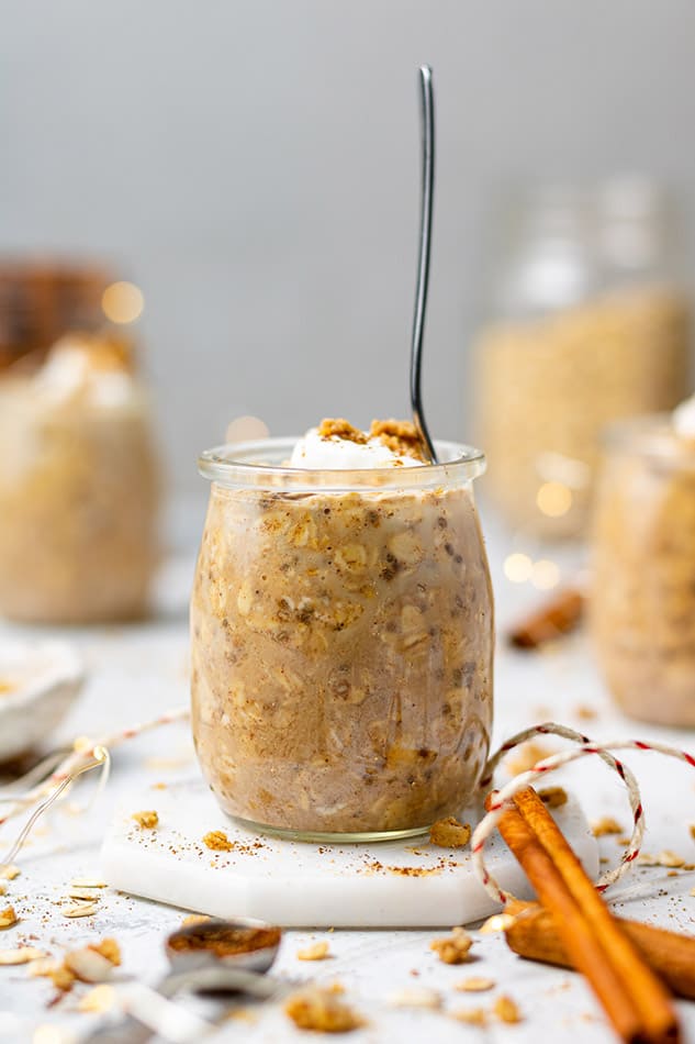 Side view of a jar of Gingerbread Overnight Oats with a spoon