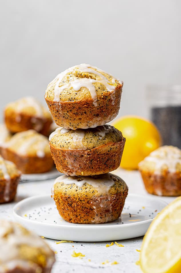 Side shot of three lemon muffins stacked on each other