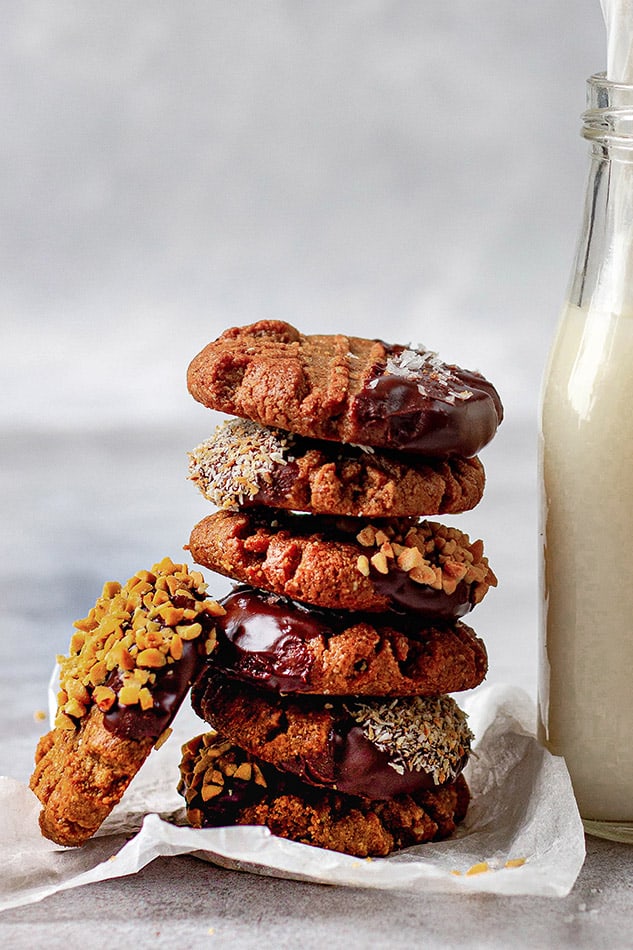 A stack of paleo pumpkin cookies dipped in chocolate 