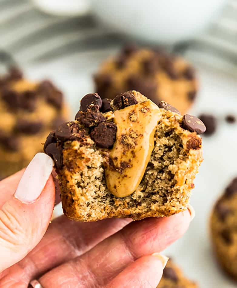 Close-up view of zucchini muffins with chocolate chips and almond butter.