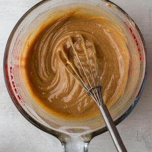 Mixing bowl of peanut butter filling with a whisk