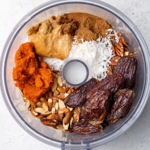Ingredients for pumpkin energy balls in a food processor bowl