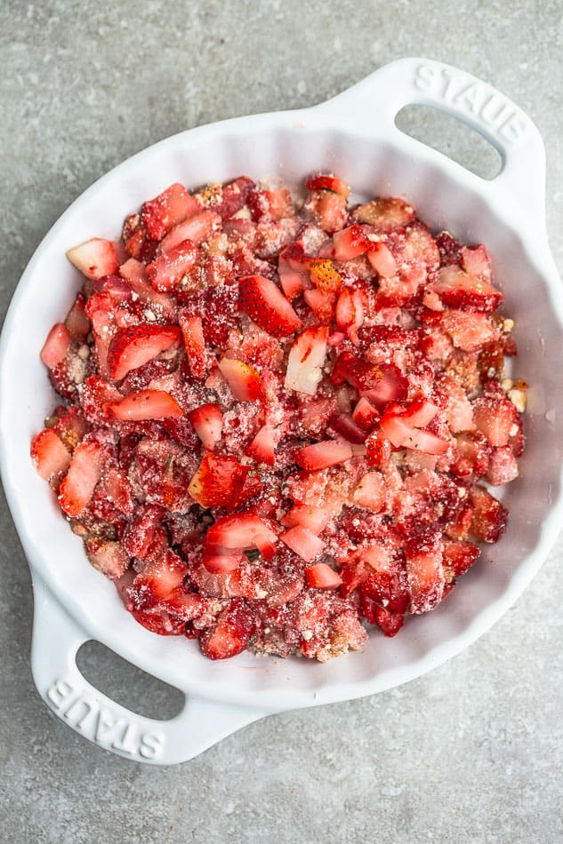 Overhead image of strawberry crisp filled with fresh strawberries.