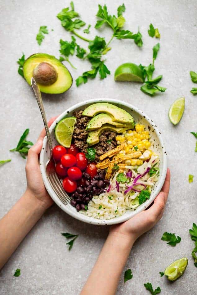 Healthy Taco Bowls - a quick & delicious lightened up 30 minute lunch or dinner perfect for busy weeknights. Best of all, made with a flavorful homemade Tex-Mex seasoning and options for low carb, keto and meal prep.