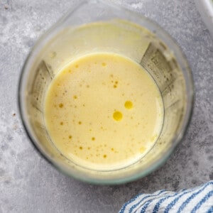 Lemon mustard vinaigrette in a measuring cup