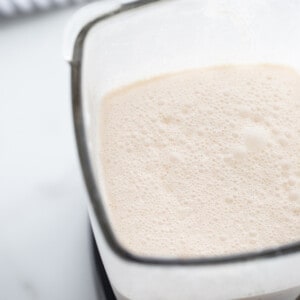 Top view of blended healthy vanilla ice cream in a blender