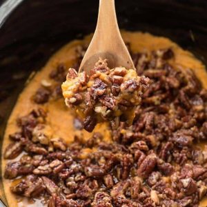 Pecan-topped sweet potato casserole in a slow cooker
