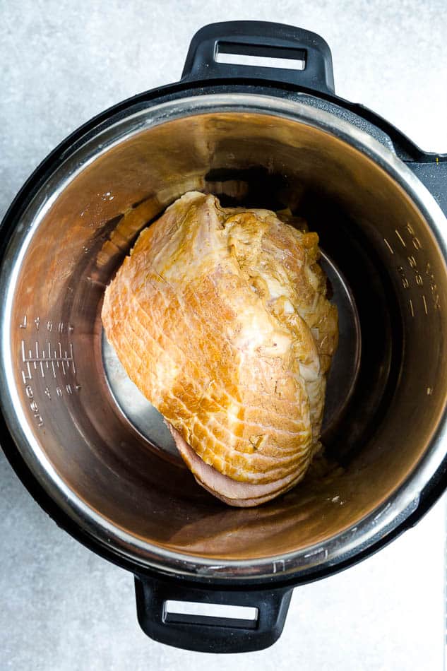 Top view of uncooked instant Pot Ham in a pressure cooker