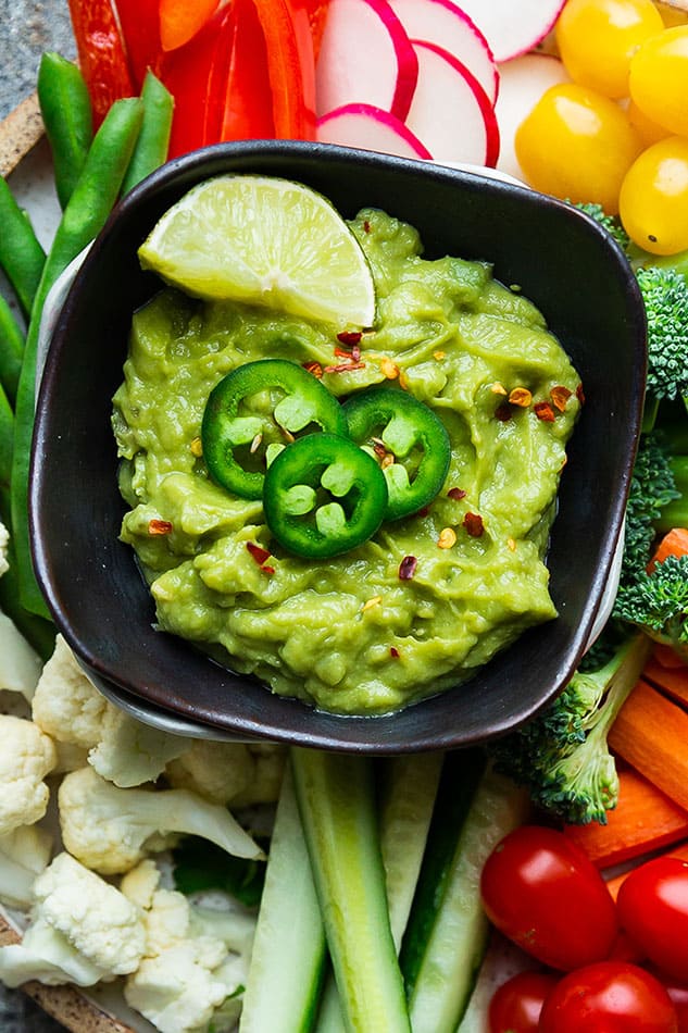 Top view of Homemade Guacamole in a Black Bowl