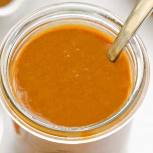 Top shot of a jar full of homemade caramel sauce in a jar