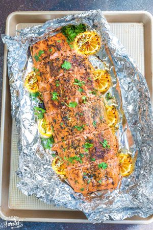 Honey Lemon Salmon in foil is baked to tender, flaky perfection. Best of all, it's fresh, flavorful and super delicious! Comes together in less than 30 minutes and is just perfect for busy weeknights! With sweet and tangy honey, lemon and parsley and the perfect spring or summer meal!