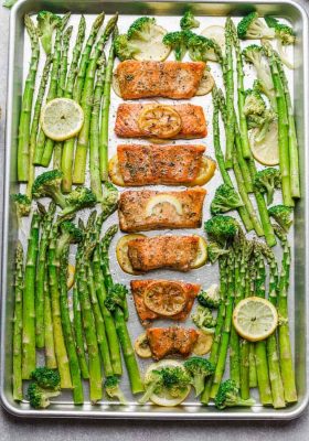 Honey Lemon Salmon with asparagus and broccoli is baked to tender, flaky perfection. Best of all, it's fresh, flavorful and super delicious! Comes together in less than 30 minutes and is just perfect for busy weeknights! Made with a sweet and tangy honey, lemon and parsley and the perfect spring or summer meal! Line baking sheet with parchment paper or foil for easier clean up.