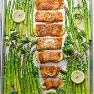 Honey Lemon Salmon with asparagus and broccoli is baked to tender, flaky perfection. Best of all, it's fresh, flavorful and super delicious! Comes together in less than 30 minutes and is just perfect for busy weeknights! Made with a sweet and tangy honey, lemon and parsley and the perfect spring or summer meal! Line baking sheet with parchment paper or foil for easier clean up.