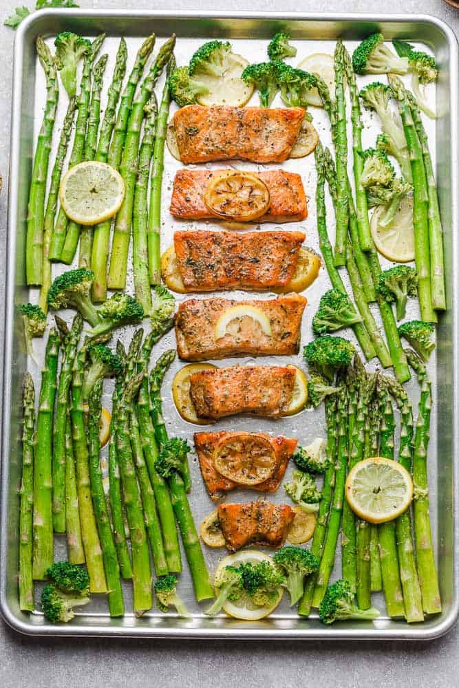 Honey Lemon Salmon with asparagus and broccoli is baked to tender, flaky perfection. Best of all, it's fresh, flavorful and super delicious! Comes together in less than 30 minutes and is just perfect for busy weeknights! Made with a sweet and tangy honey, lemon and parsley and the perfect spring or summer meal! Line baking sheet with parchment paper or foil for easier clean up.