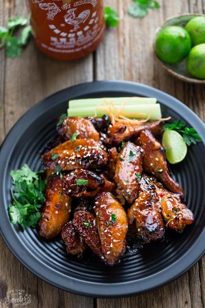 Honey Lime Sriracha Chicken Wings makes the perfect appetizers for game day. Best of all, they're so easy to make with a flavorful and delicious Asian inspired sticky sauce.