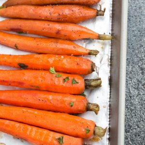 Top view of honey roasted carrots on a sheet pan
