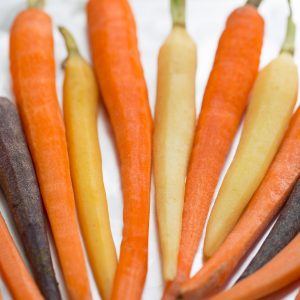 Close-up of peeled whole rainbow carrots